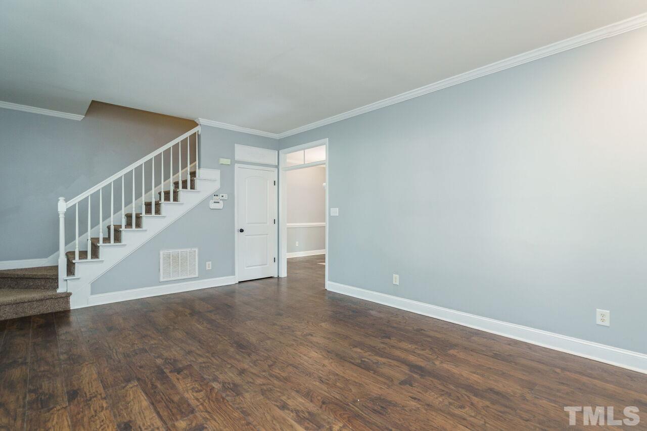 4202 Holt School Road Durham, NC 27704 - Photo 6 of 27 a view of an empty room with wooden floor