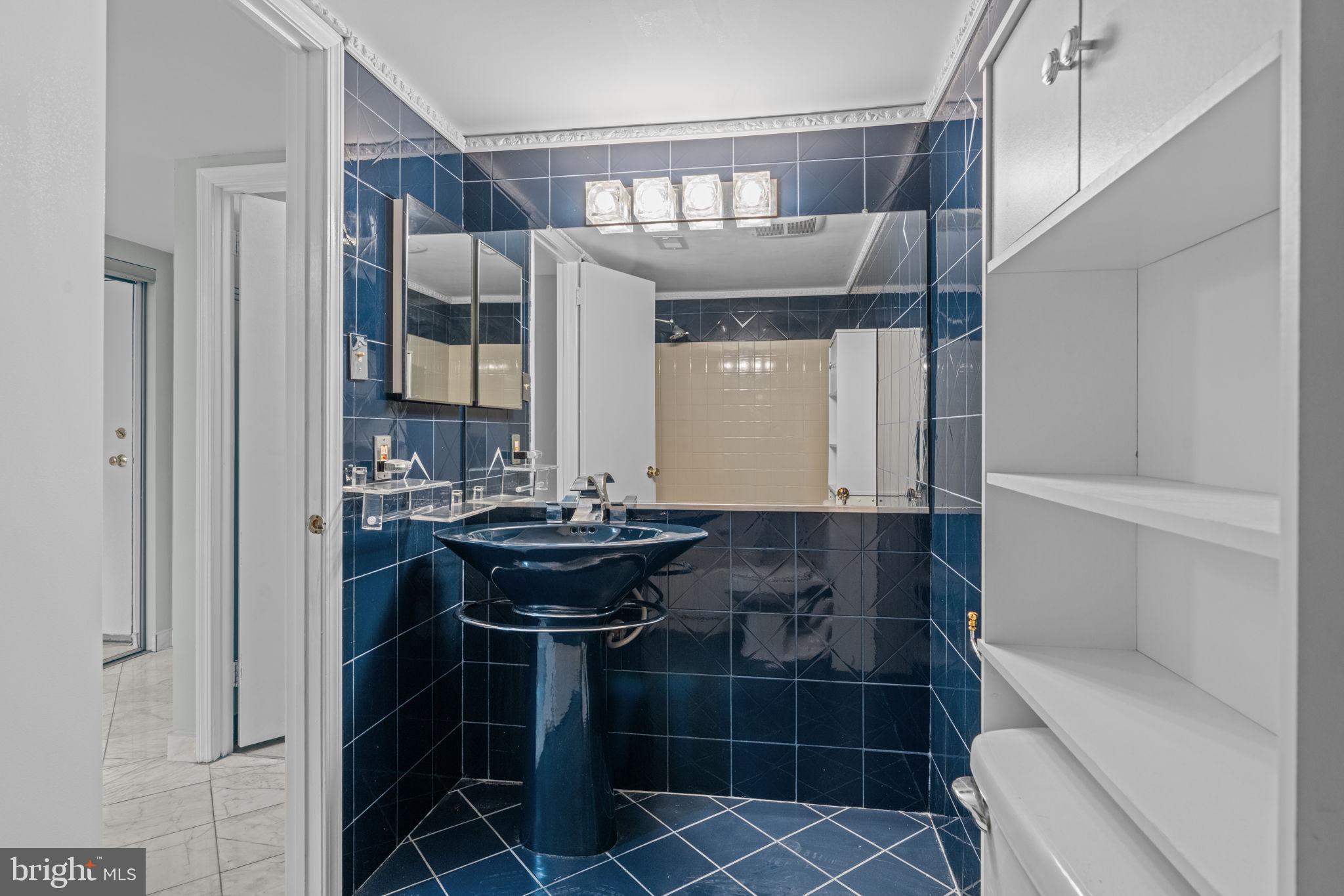 2131 Welsh Road, Unit 208 Philadelphia, PA 19115 - Photo 5 of 21 a bathroom with a sink and a mirror