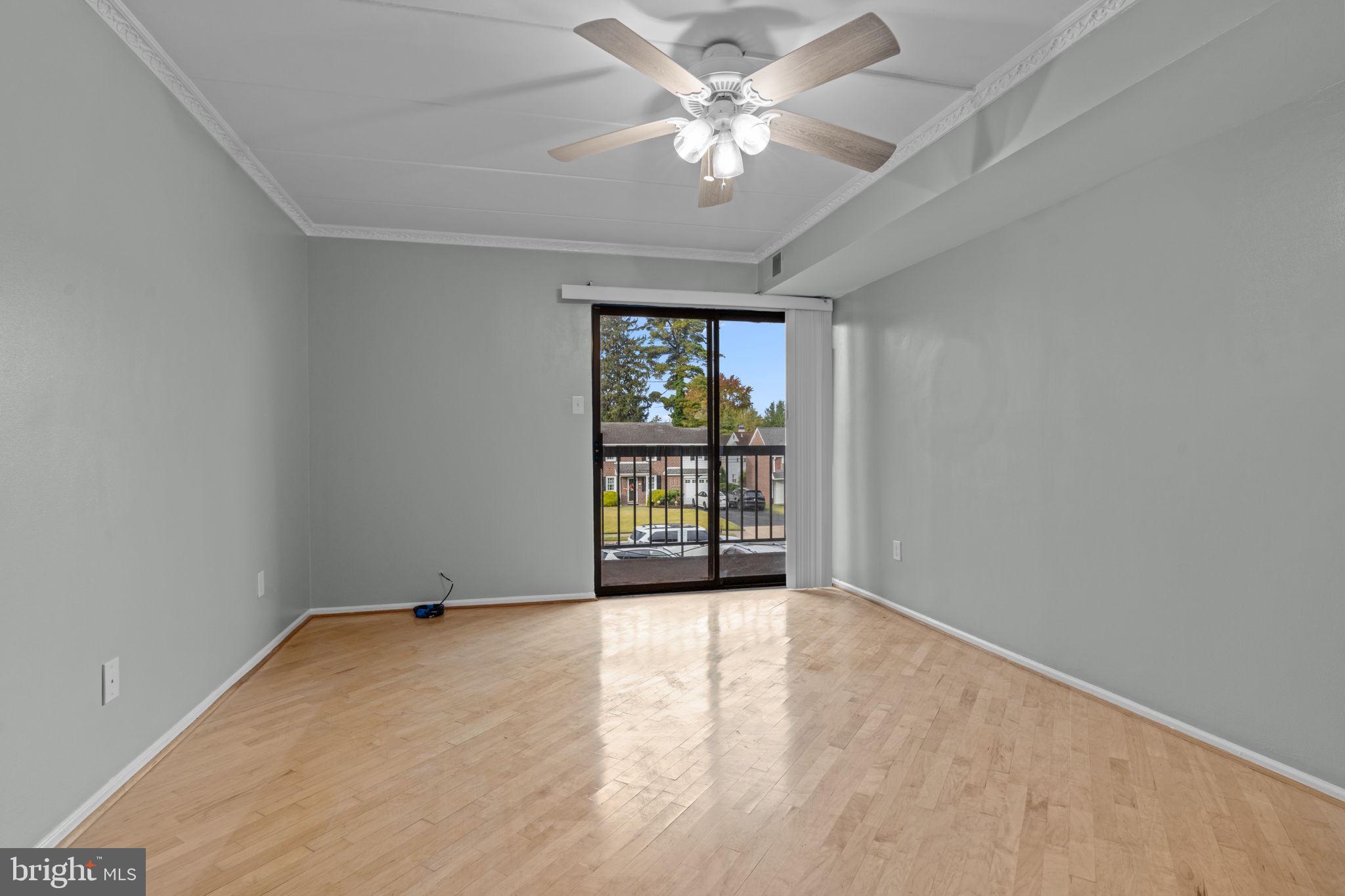 2131 Welsh Road, Unit 208 Philadelphia, PA 19115 - Photo 7 of 21 an empty room with windows and ceiling fan