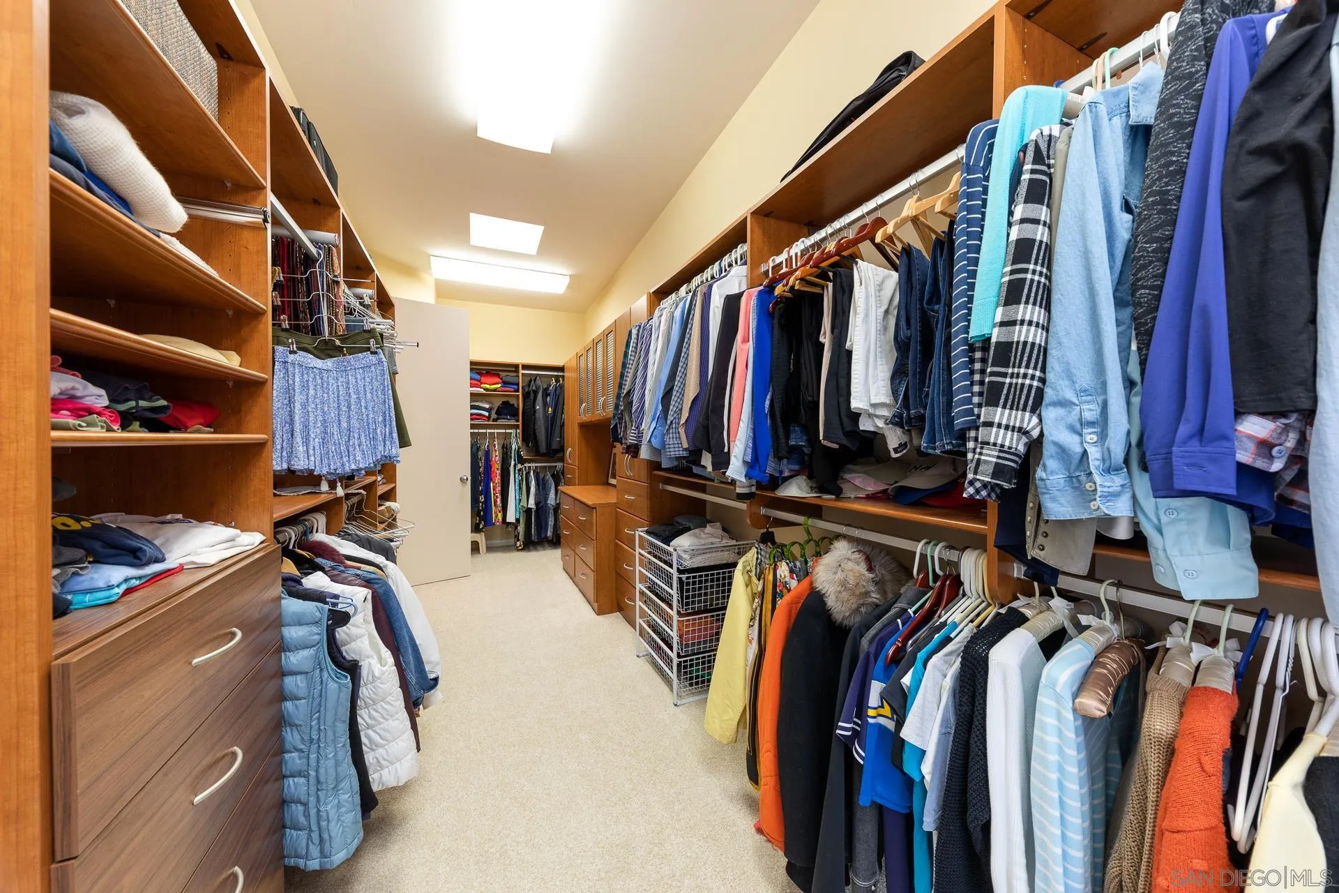 13748 Pine Needles Drive Del Mar, CA 92014 - Photo 19 of 49 a view of walk in closet with clothes