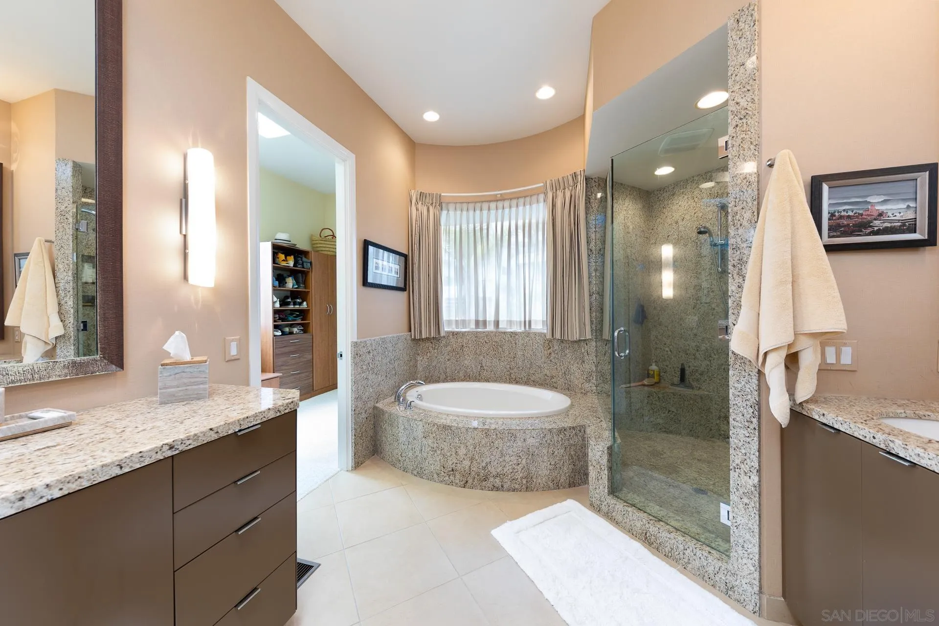 13748 Pine Needles Drive Del Mar, CA 92014 - Photo 20 of 49 a spacious bathroom with a granite countertop sink a mirror and a shower