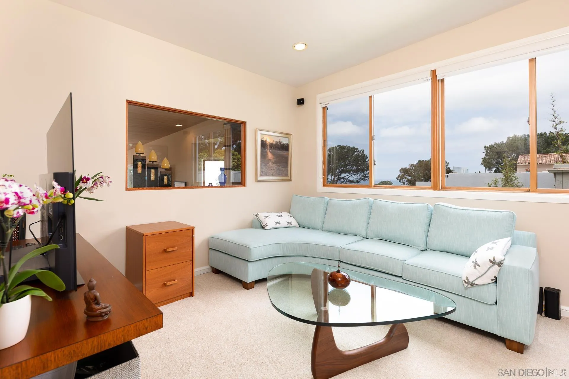 13748 Pine Needles Drive Del Mar, CA 92014 - Photo 22 of 49 a living room with furniture and a large window