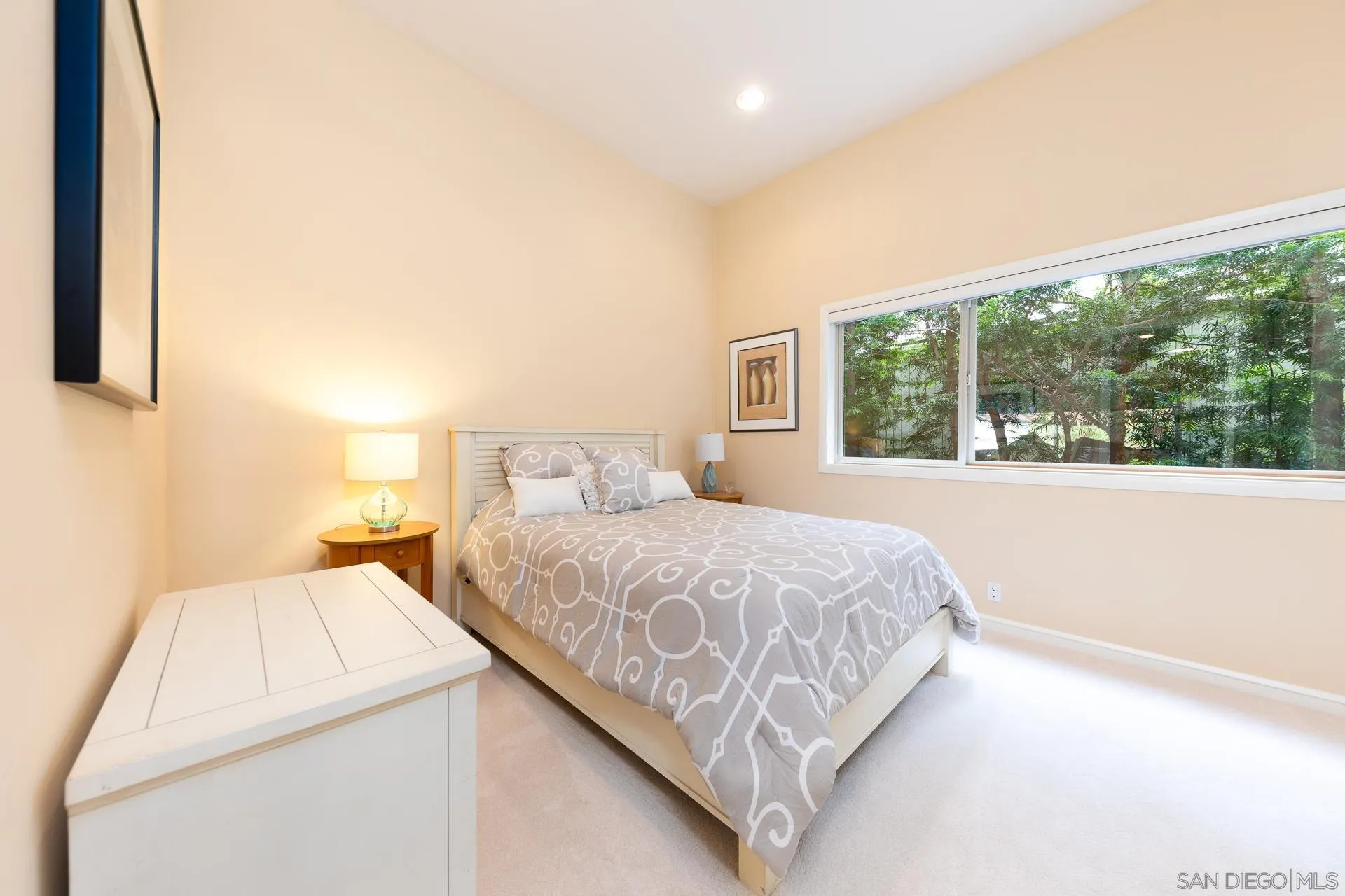 13748 Pine Needles Drive Del Mar, CA 92014 - Photo 23 of 49 a bedroom with a bed and a large window