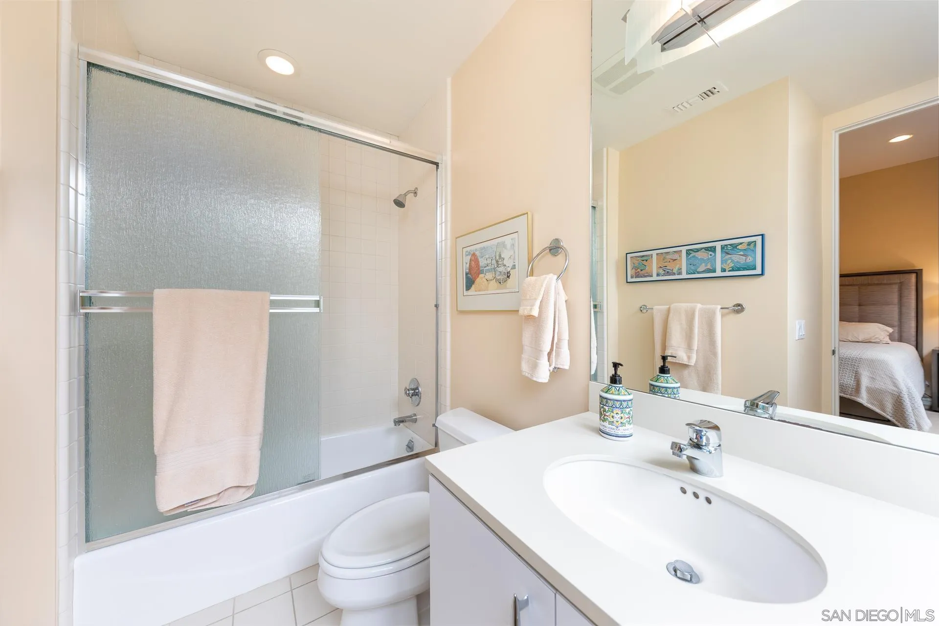 13748 Pine Needles Drive Del Mar, CA 92014 - Photo 26 of 49 a bathroom with a sink a toilet and a large mirror