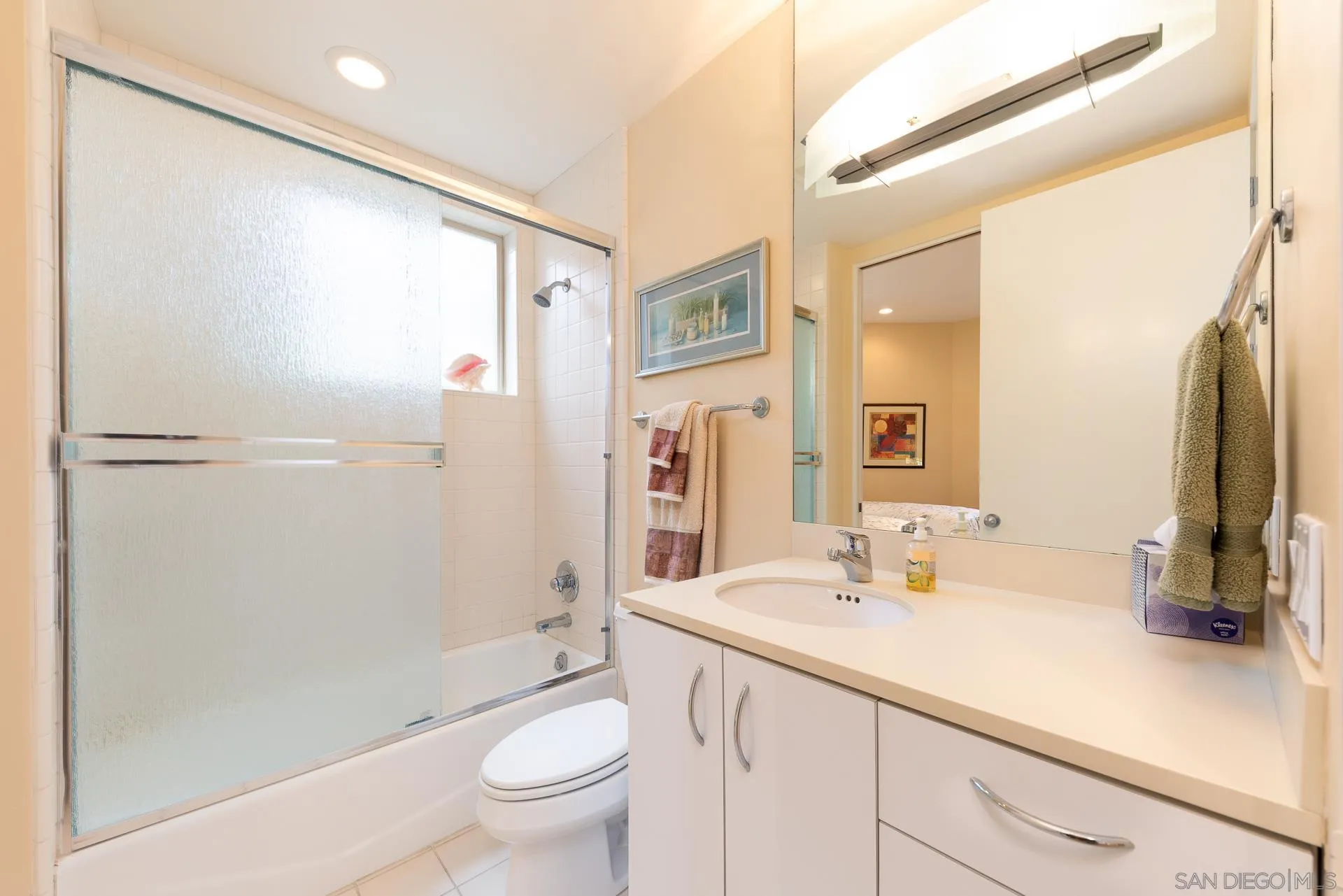 13748 Pine Needles Drive Del Mar, CA 92014 - Photo 29 of 49 a bathroom with a sink a toilet and a large mirror