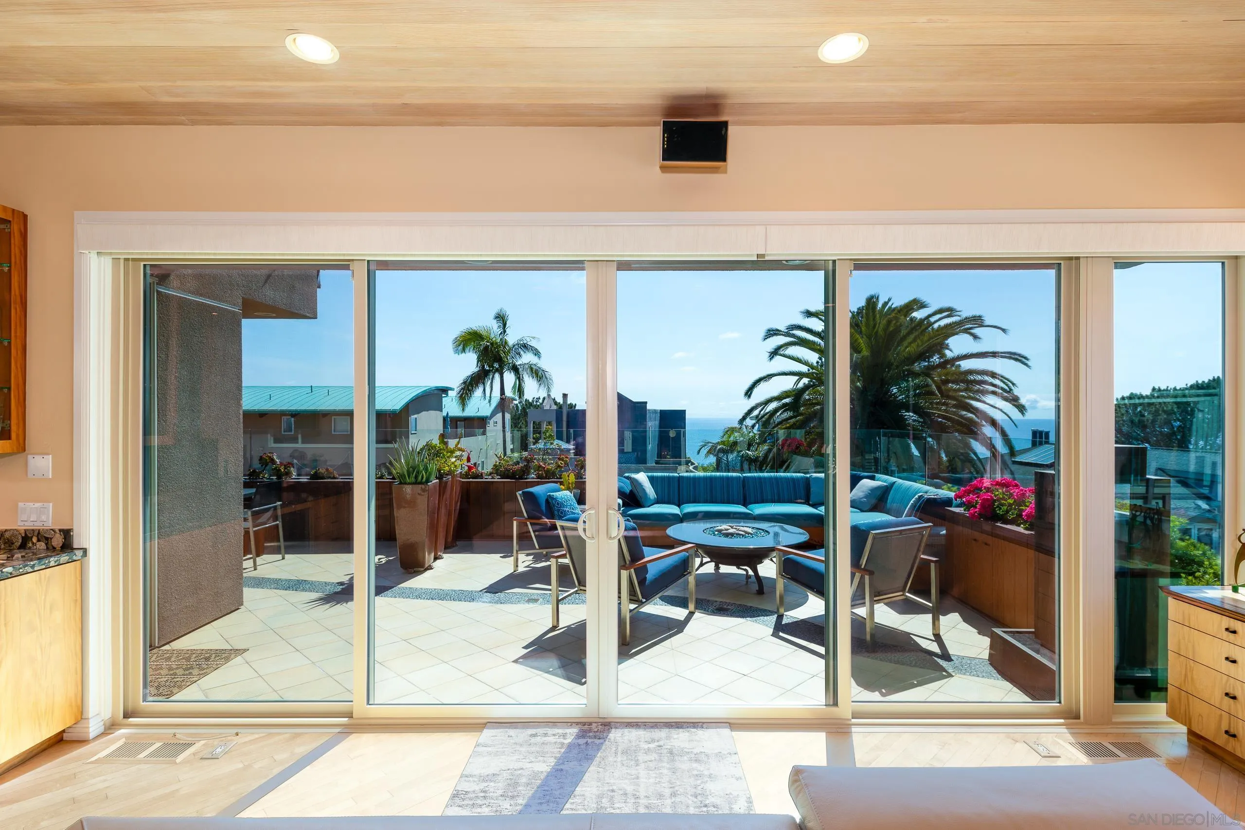 13748 Pine Needles Drive Del Mar, CA 92014 - Photo 35 of 49 a view of a patio with a table and chairs