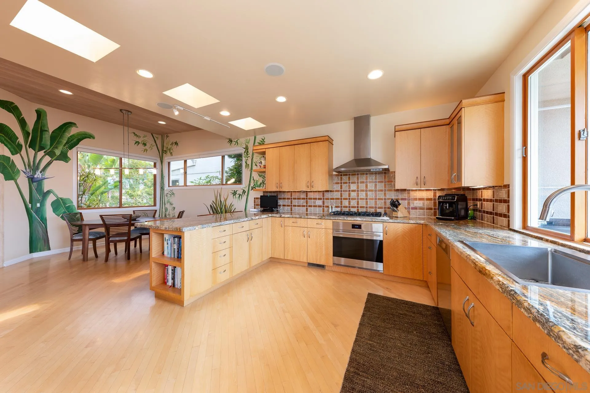 13748 Pine Needles Drive Del Mar, CA 92014 - Photo 7 of 49 a large white kitchen with lots of counter top space