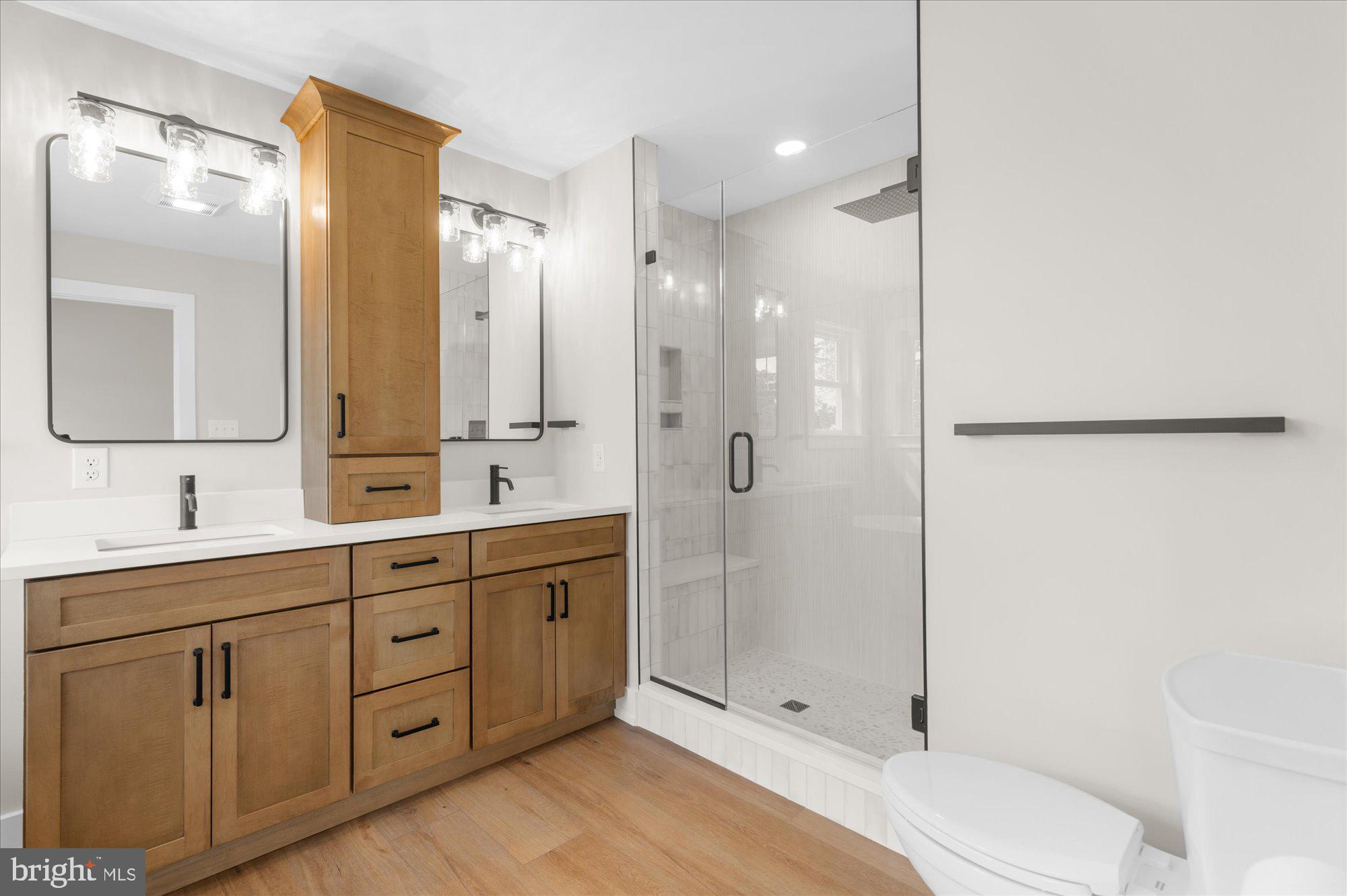 394 Renninger Road Perkiomenville, PA 18074 - Photo 27 of 41 a bathroom with a double vanity sink toilet mirror and shower