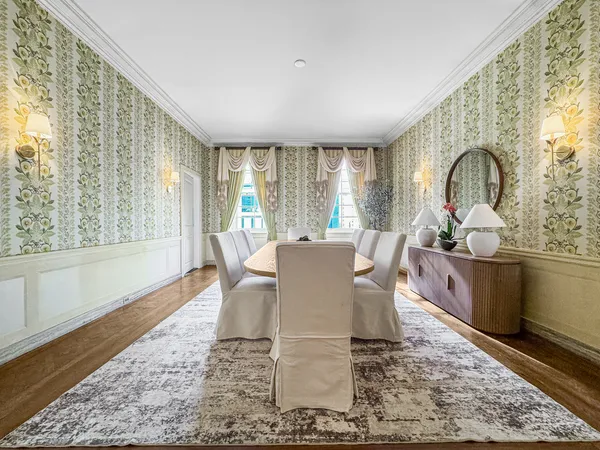 a view of a dining room with furniture window and outside view
