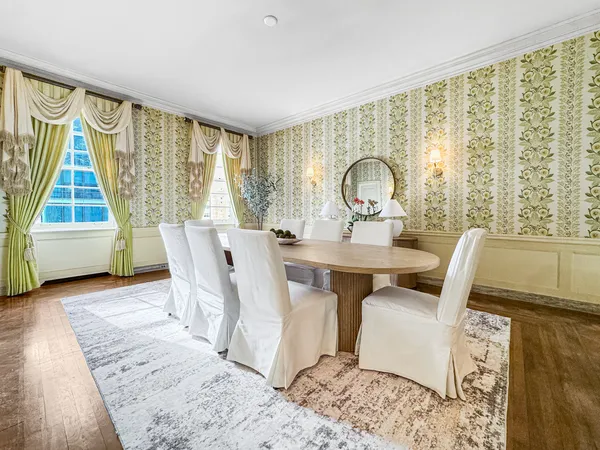 a kitchen with stainless steel appliances a white counter top space cabinets and a window