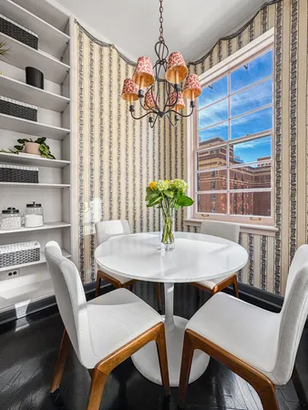a spacious bedroom with a bed and glass window