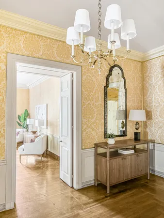 a living room with fireplace furniture and a wooden floor