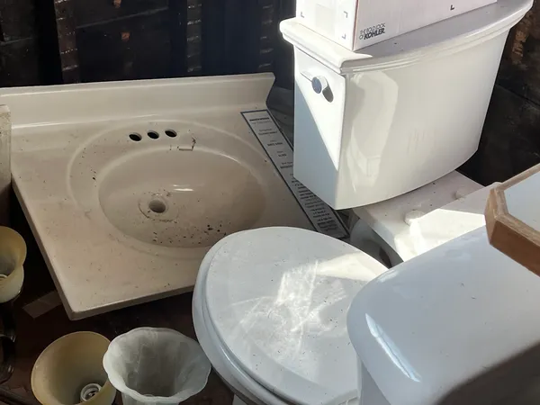 a bathroom with a toilet and mirror