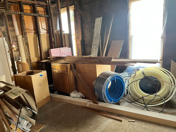a room with chairs and window