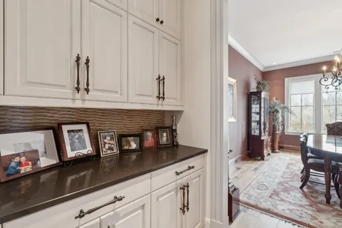 a kitchen with stainless steel appliances granite countertop a refrigerator and cabinets