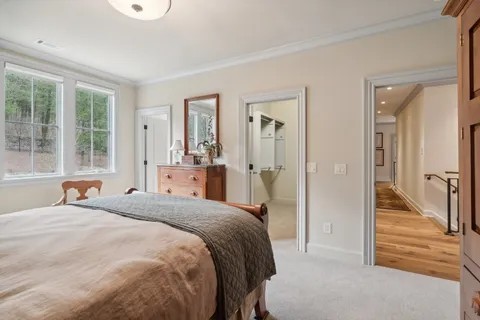 a en suite bathroom with a granite countertop sink and a mirror