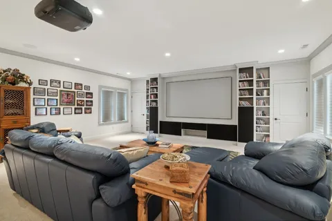 a living room with furniture wooden floor and a window