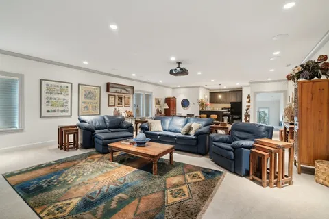 a kitchen with stainless steel appliances granite countertop a sink cabinets and wooden floor