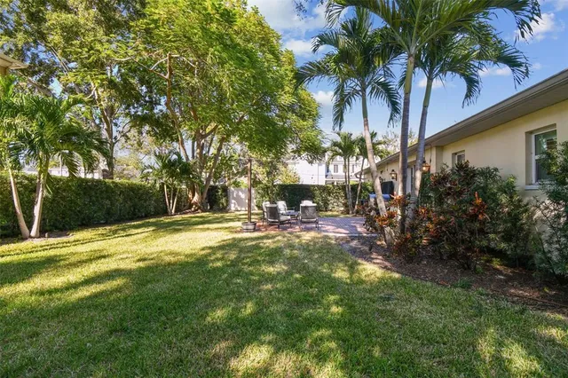 a view of swimming pool with a table and chairs