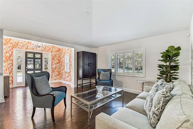 a living room with furniture and a window