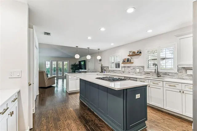 a kitchen with a stove and cabinets
