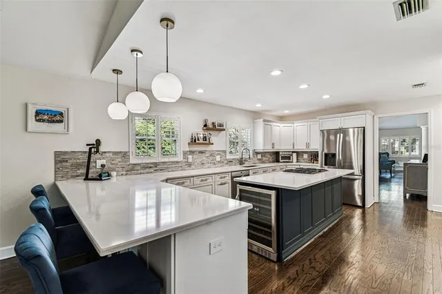 a kitchen with center island and stove