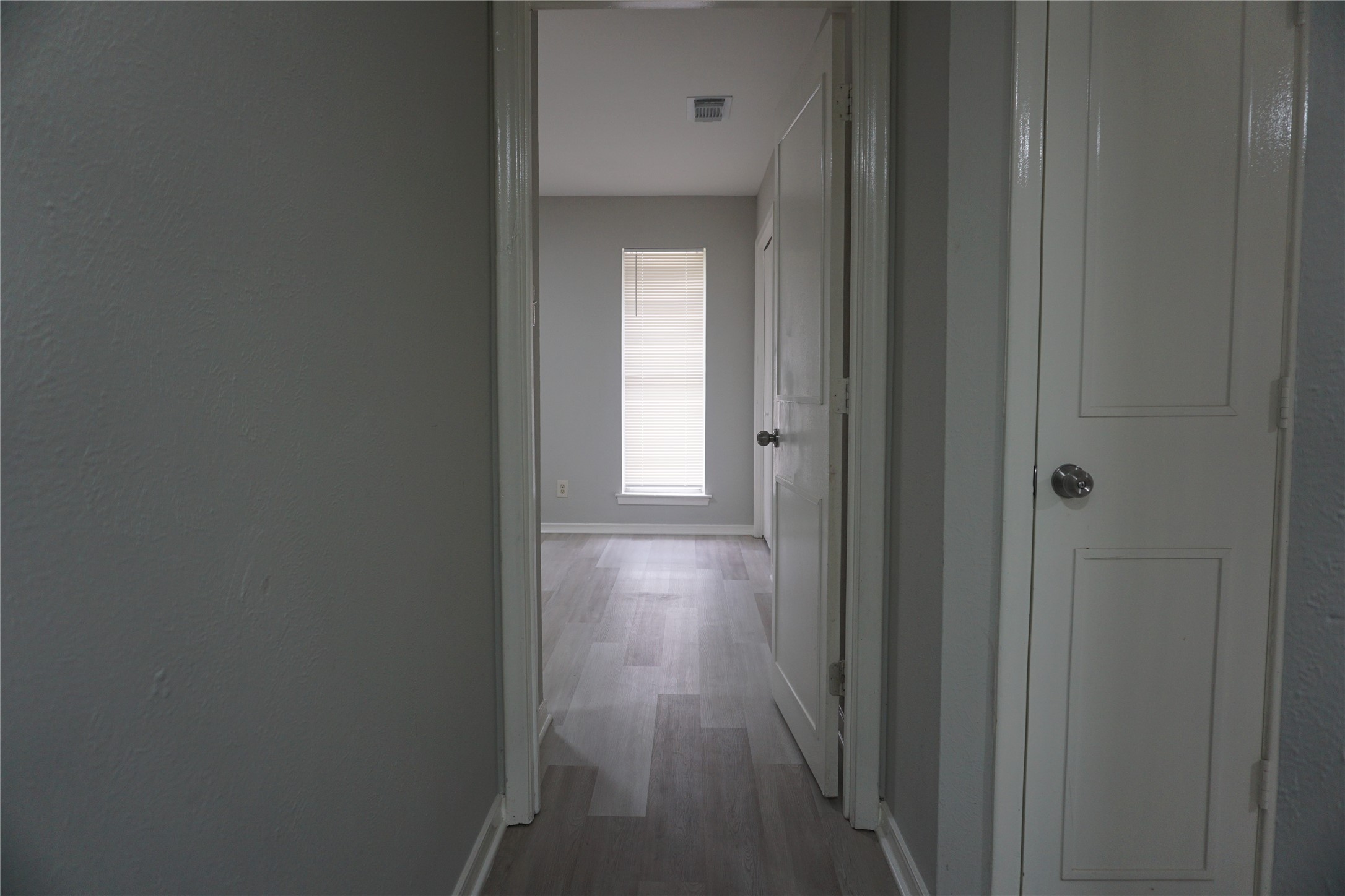 1913 Normal Park Drive, Unit B Huntsville, TX 77340 - Photo 13 of 29 a view of a hallway with wooden floor