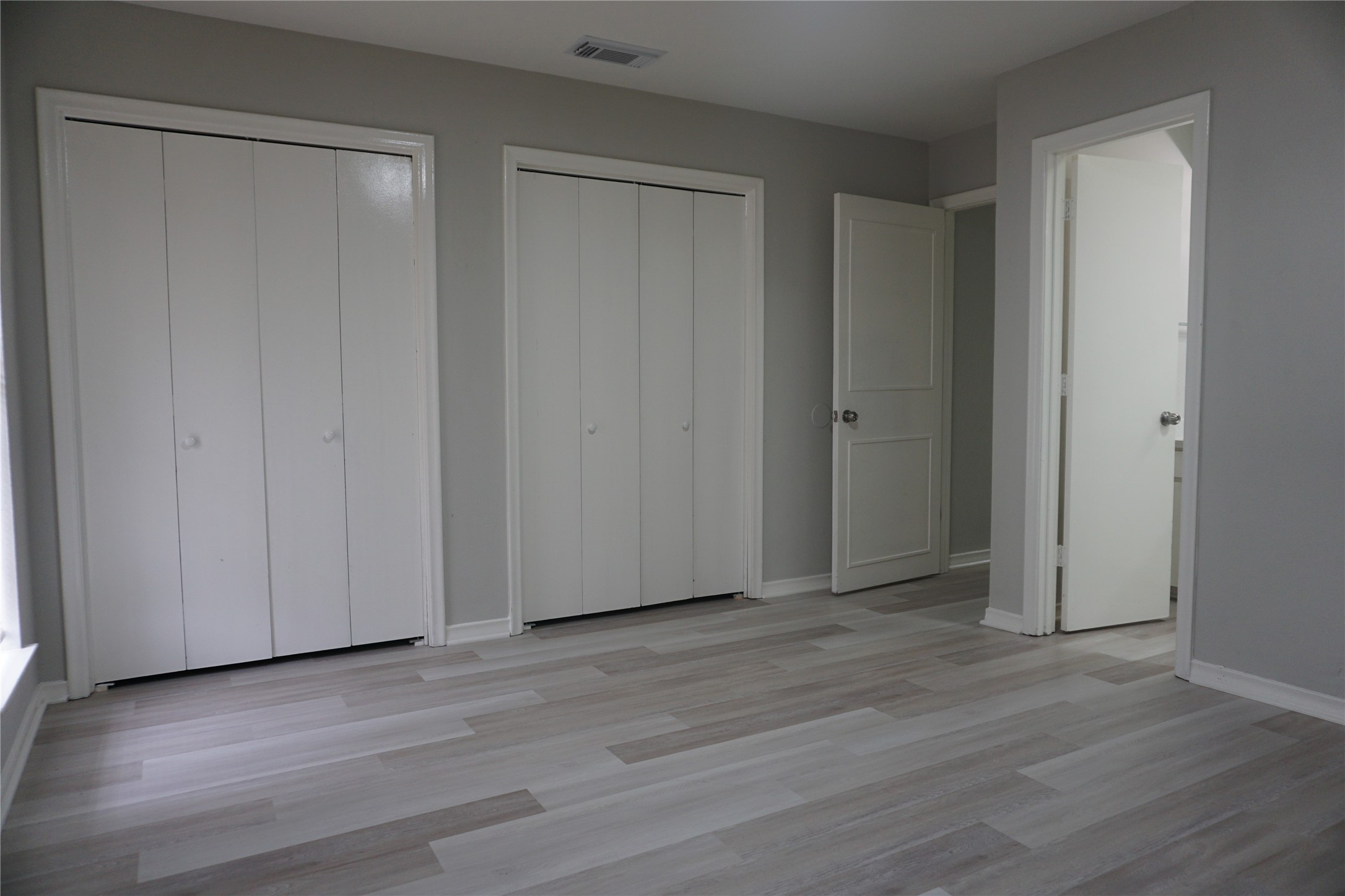 1913 Normal Park Drive, Unit B Huntsville, TX 77340 - Photo 15 of 29 a view of empty room with wooden floor