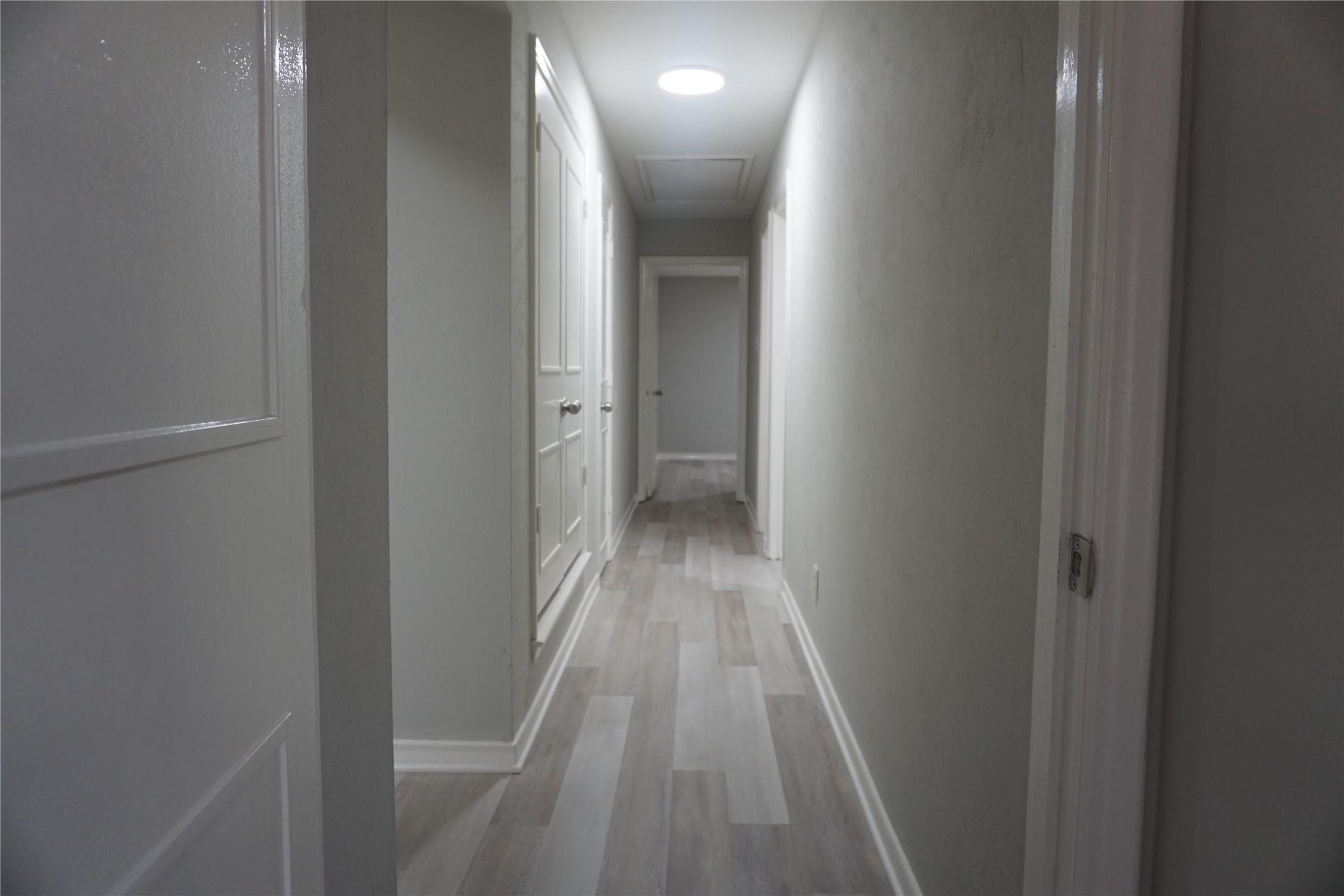 1913 Normal Park Drive, Unit B Huntsville, TX 77340 - Photo 17 of 29 a view of a hallway with wooden floor