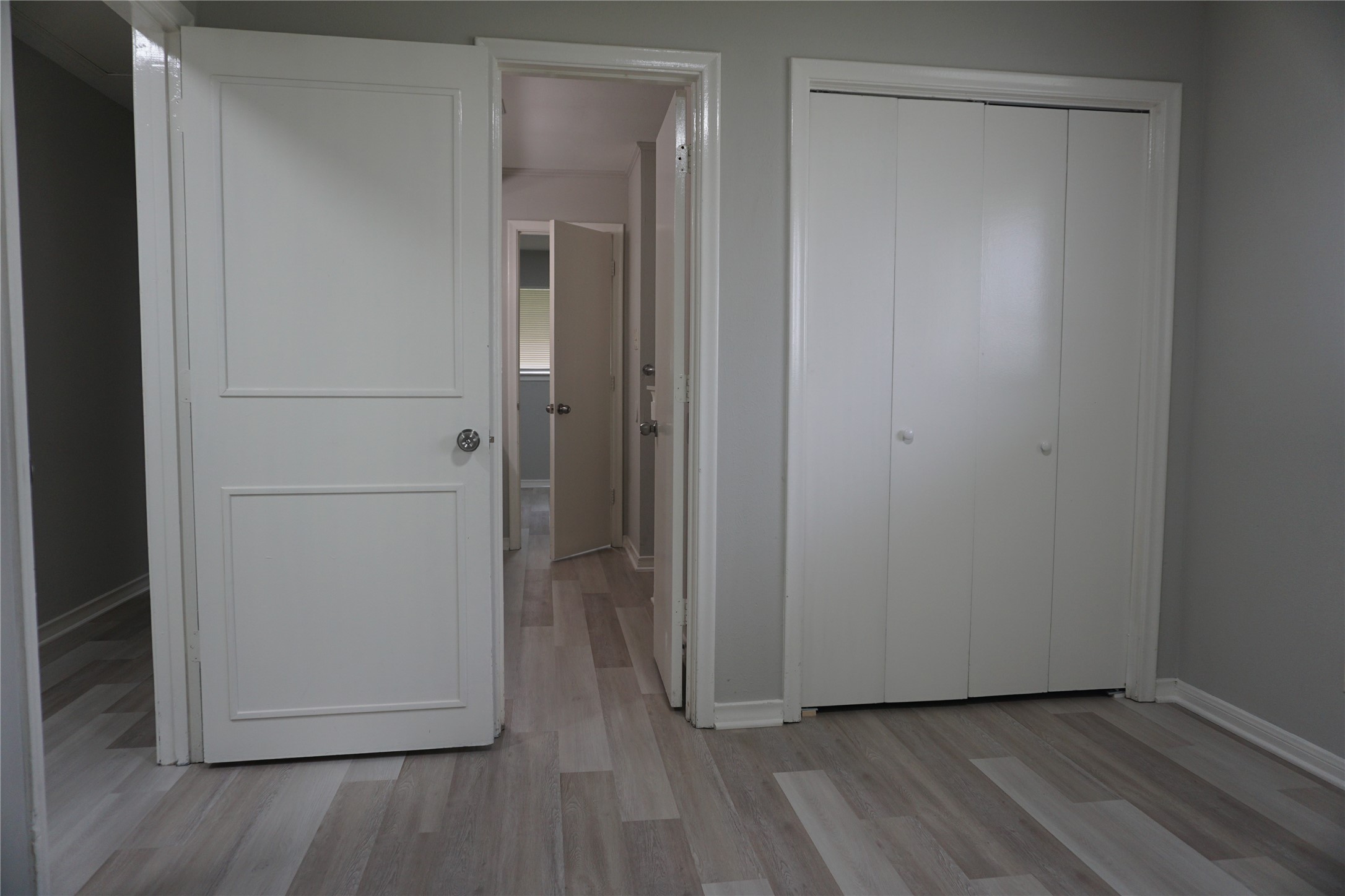 1913 Normal Park Drive, Unit B Huntsville, TX 77340 - Photo 19 of 29 a view of an empty room with closet and wooden floor