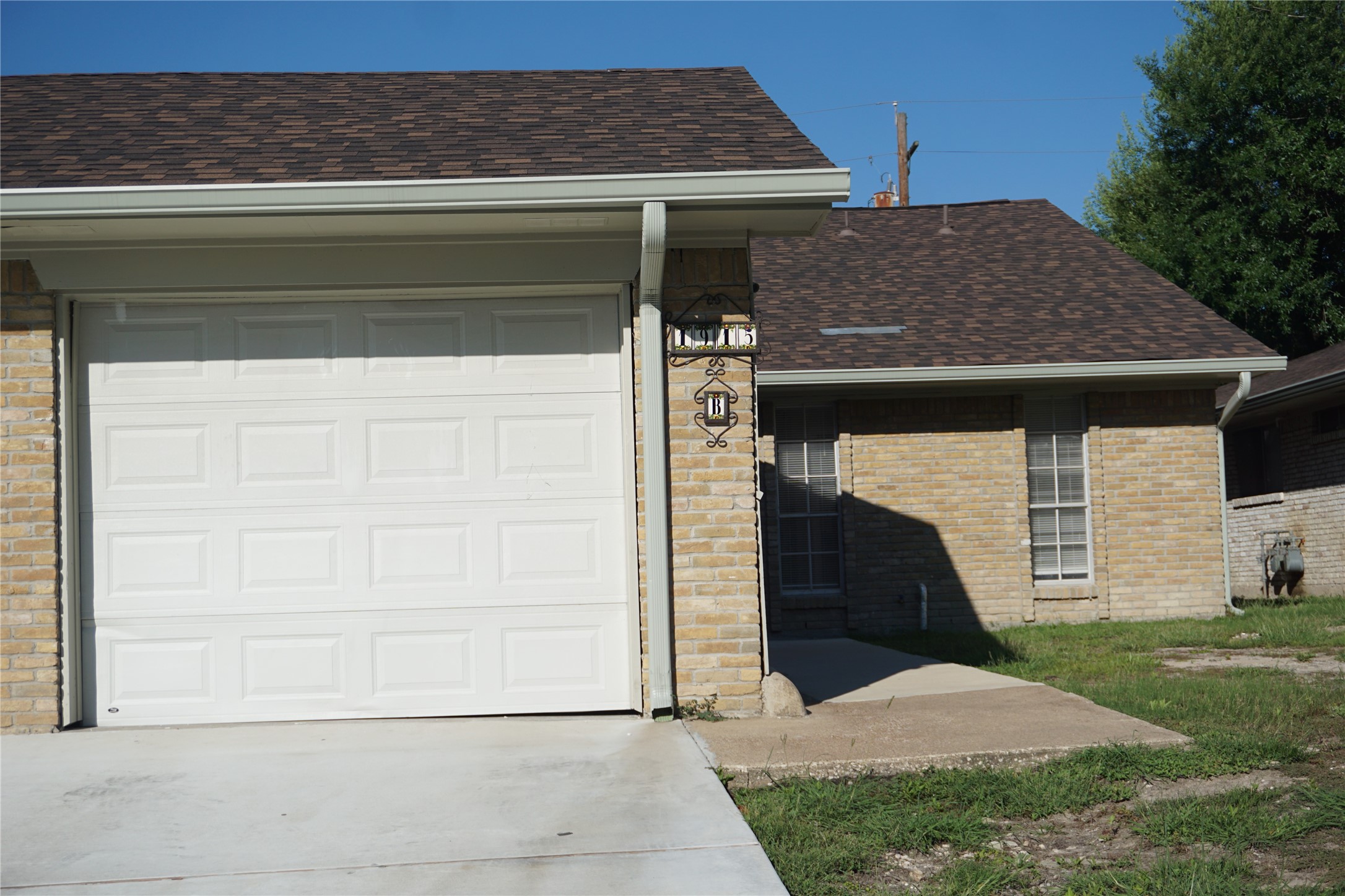 1913 Normal Park Drive, Unit B Huntsville, TX 77340 - Photo 2 of 29 a front view of a house with garden