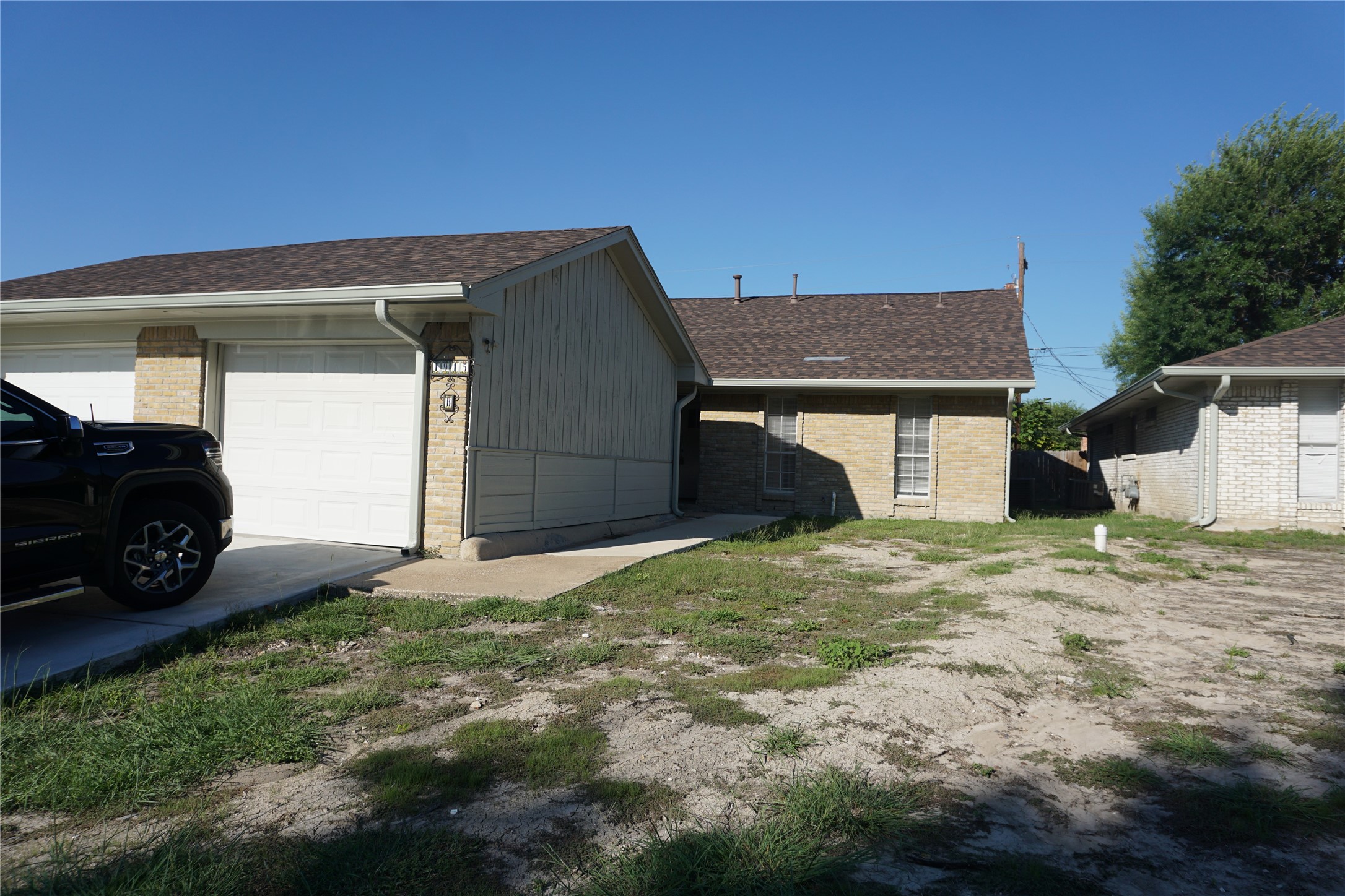 1913 Normal Park Drive, Unit B Huntsville, TX 77340 - Photo 3 of 29 a house with a yard