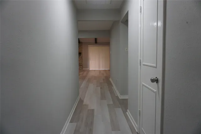 a view of a bathroom from a hallway