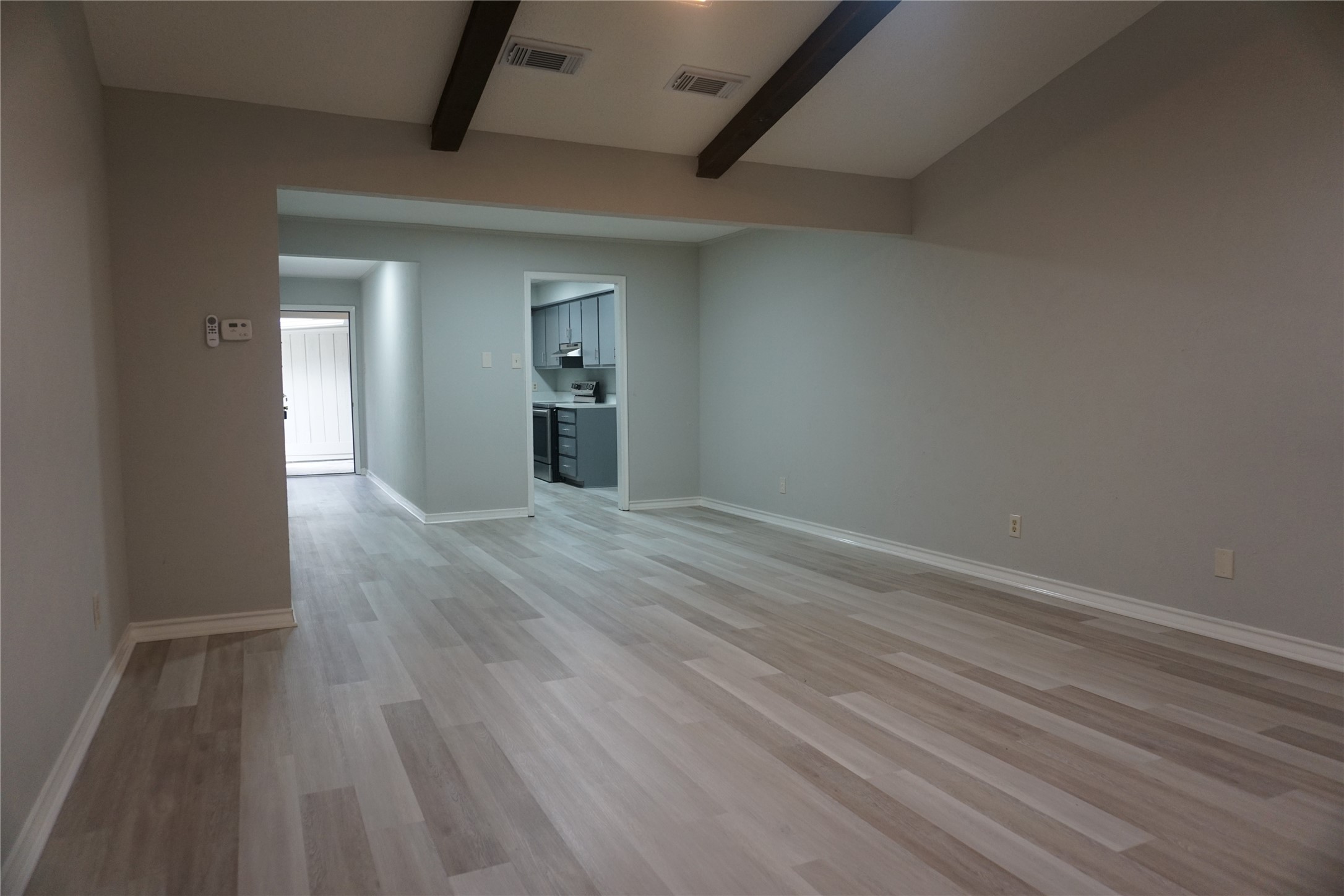 1913 Normal Park Drive, Unit B Huntsville, TX 77340 - Photo 8 of 29 a view of a livingroom with wooden floor