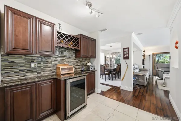 a view of a hallway with white walls and stairs