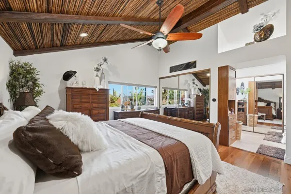 a room with stainless steel appliances lots of counter space and furniture