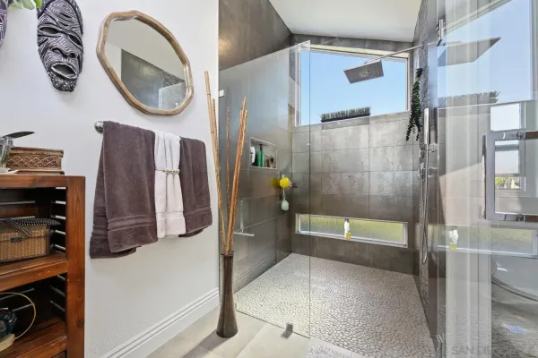 a view of a workspace with furniture and a bookshelf