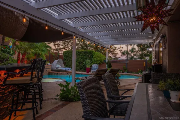 a view of a swimming pool with a patio