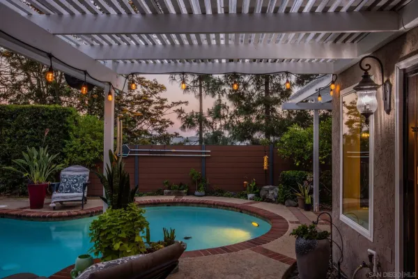 a view of a chairs and tables in a patio