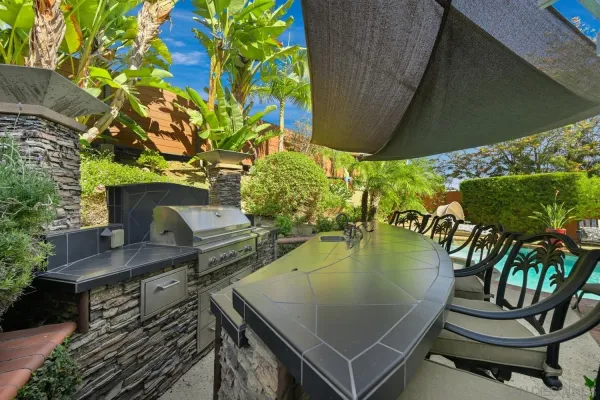 a view of patio with a table and chairs