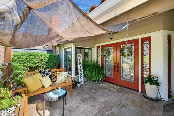a living room with furniture fireplace and a large window