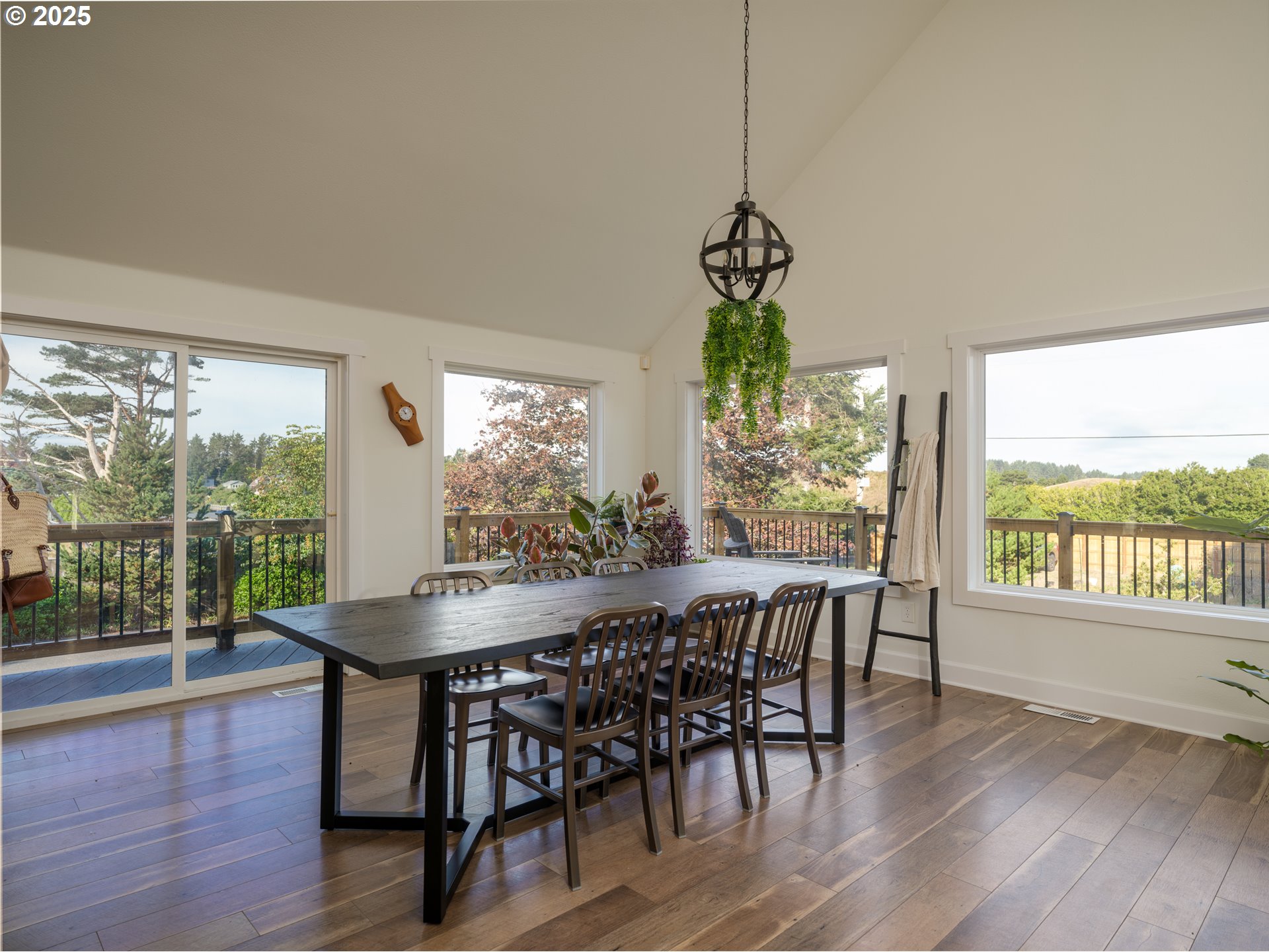 33340 Sunset Beach Road Warrenton, OR 97146 - Photo 13 of 48 a view of a dining room with furniture window and wooden floor