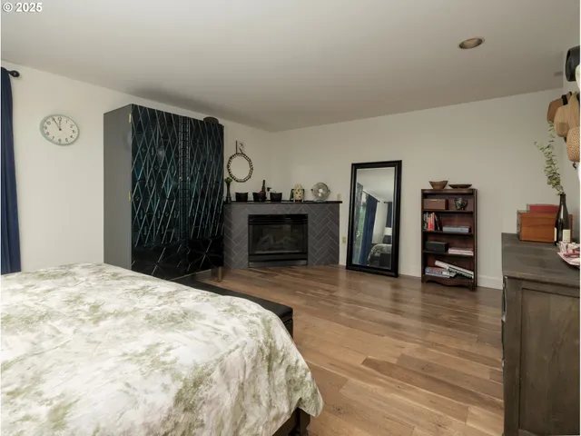 a bedroom with a bed and a television