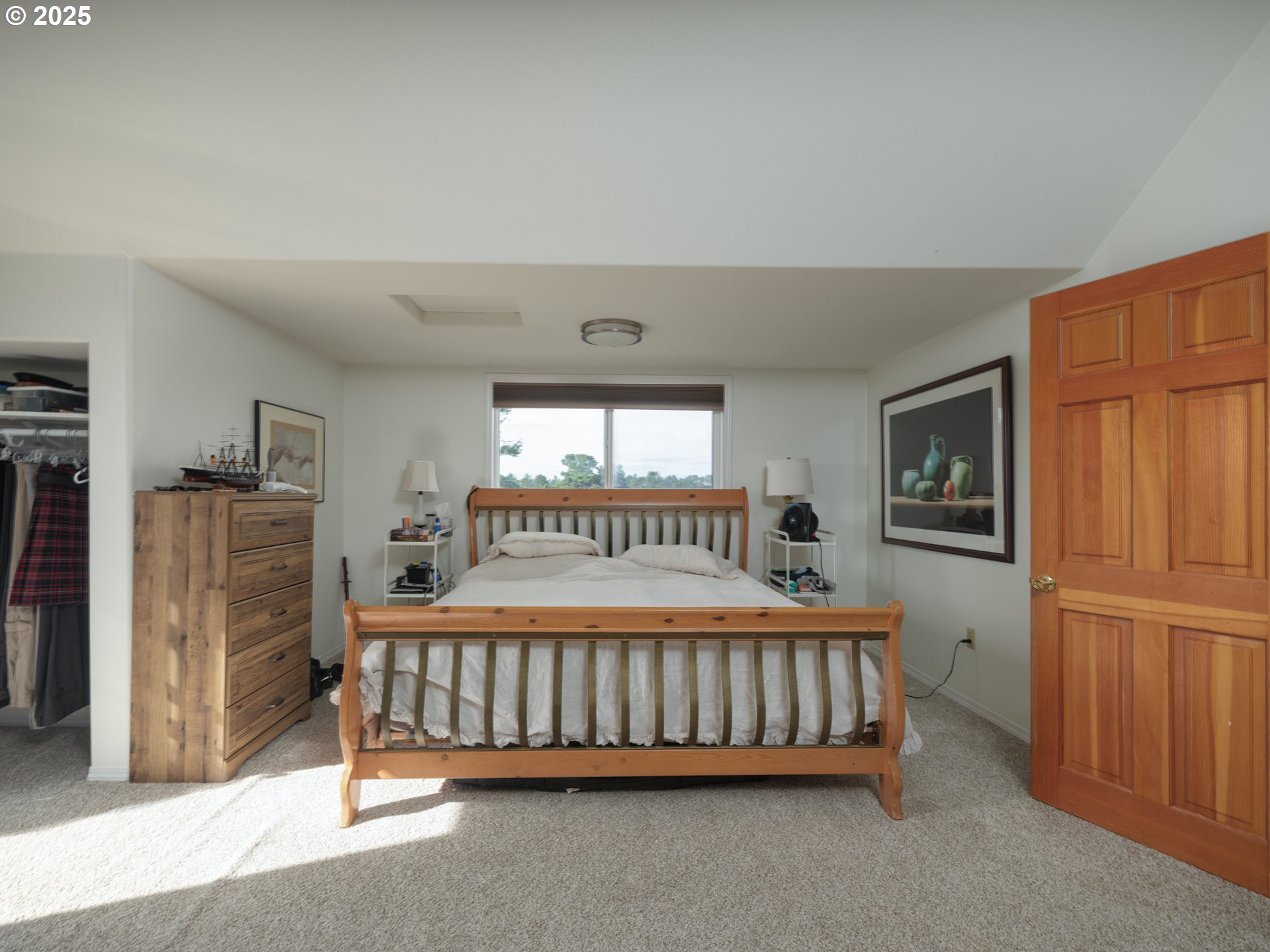 33340 Sunset Beach Road Warrenton, OR 97146 - Photo 29 of 48 a bedroom with a bed and a window