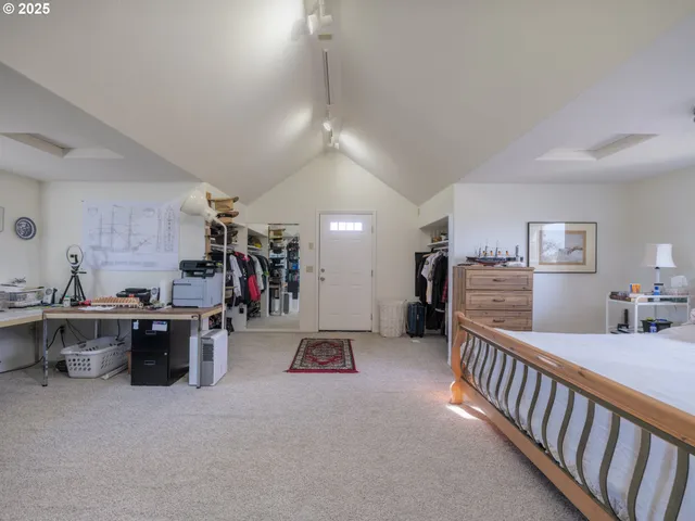 a living room with lots of furniture and white walls