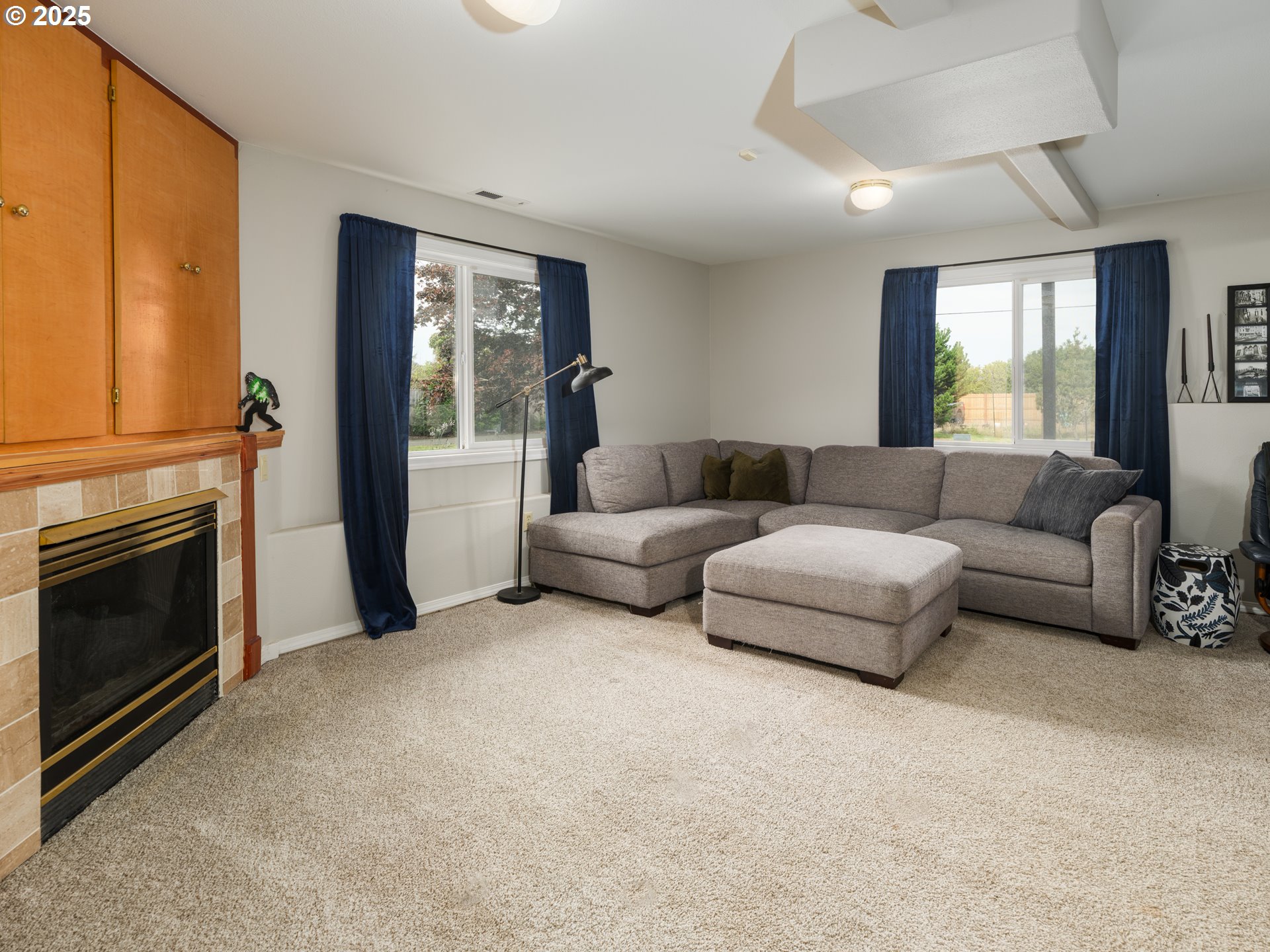 33340 Sunset Beach Road Warrenton, OR 97146 - Photo 32 of 48 a living room with furniture and a fireplace