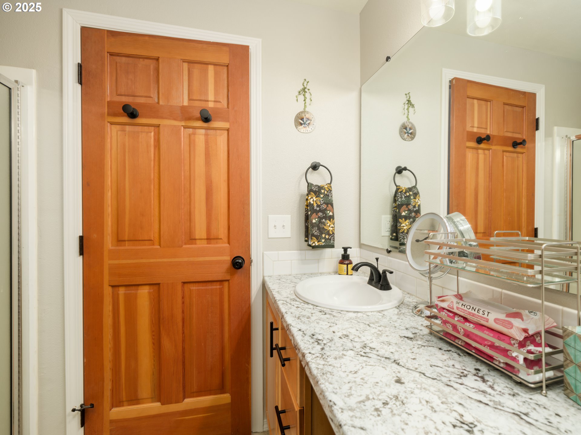 33340 Sunset Beach Road Warrenton, OR 97146 - Photo 34 of 48 a bathroom with a granite countertop sink and a mirror