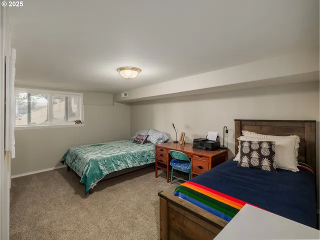 a bedroom with bed and window