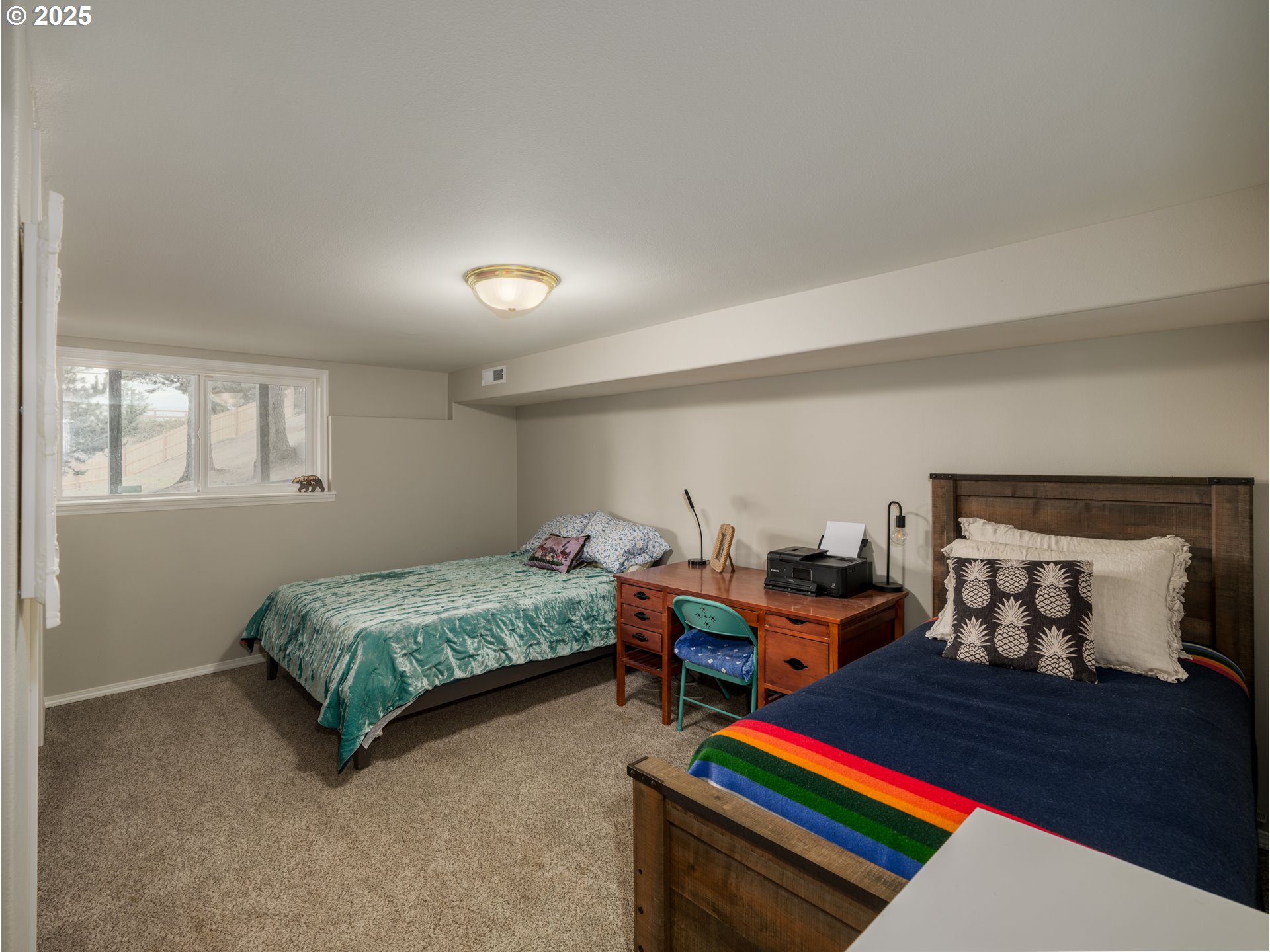 33340 Sunset Beach Road Warrenton, OR 97146 - Photo 35 of 48 a bedroom with bed and window