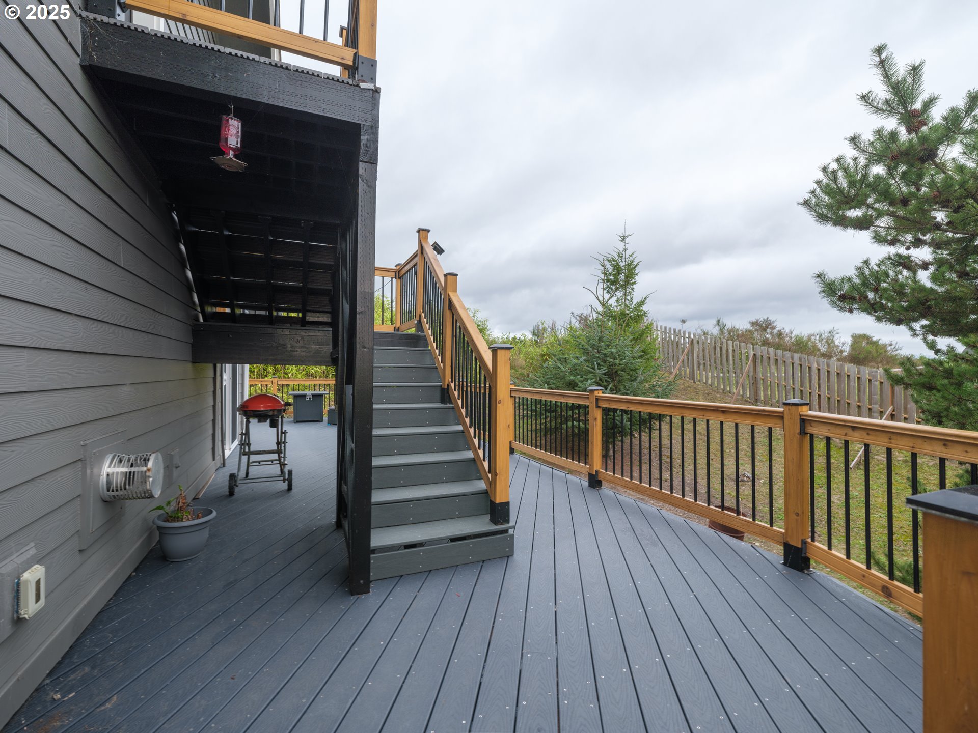 33340 Sunset Beach Road Warrenton, OR 97146 - Photo 46 of 48 a view of a balcony with wooden floor